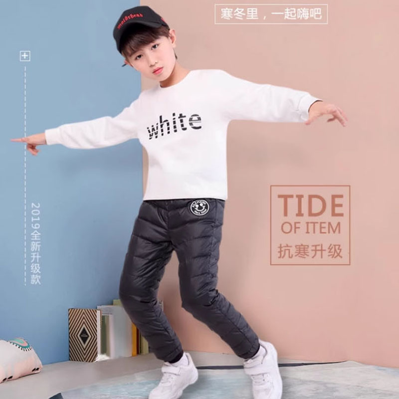 儿童冬款羽绒裤：保暖与时尚并存，中大童休闲白鸭绒裤子，潮童必备！
